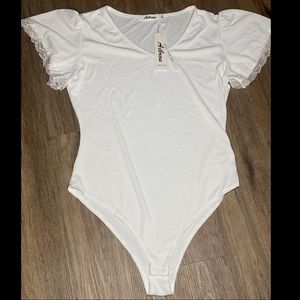 NEW WITH TAGS WHITE RIBBED BODYSUIT WITH LACE RUFFLE SLEEVES! SIZE LARGE!